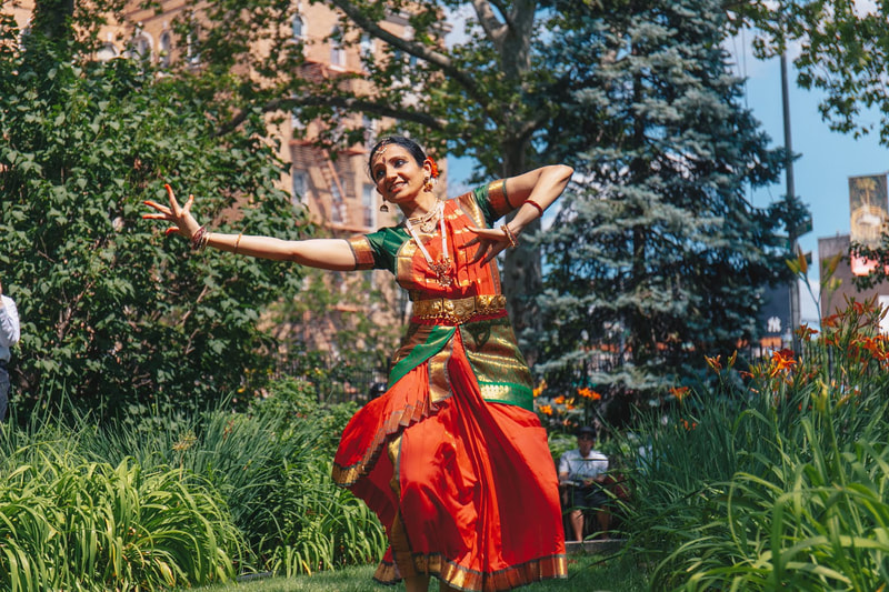 Sloka Iyengar, Indian dancer, performs in an outdoor park setting.