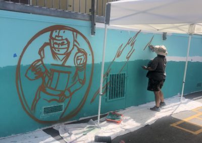 Image of a mural being painted by participants during the Yorkdale Elementary Mural Project.