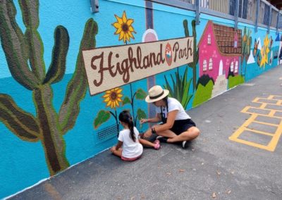 Image of a mural being painted by participants during the Yorkdale Elementary Mural Project.