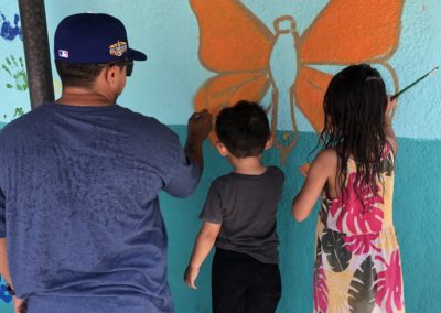 Image of a mural being painted by participants during the Yorkdale Elementary Mural Project.