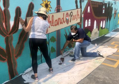 Image of a mural being painted by participants during the Yorkdale Elementary Mural Project.