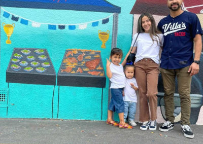 Image of participants standing in front of the mural created for the Yorkdale Elementary Mural Project.